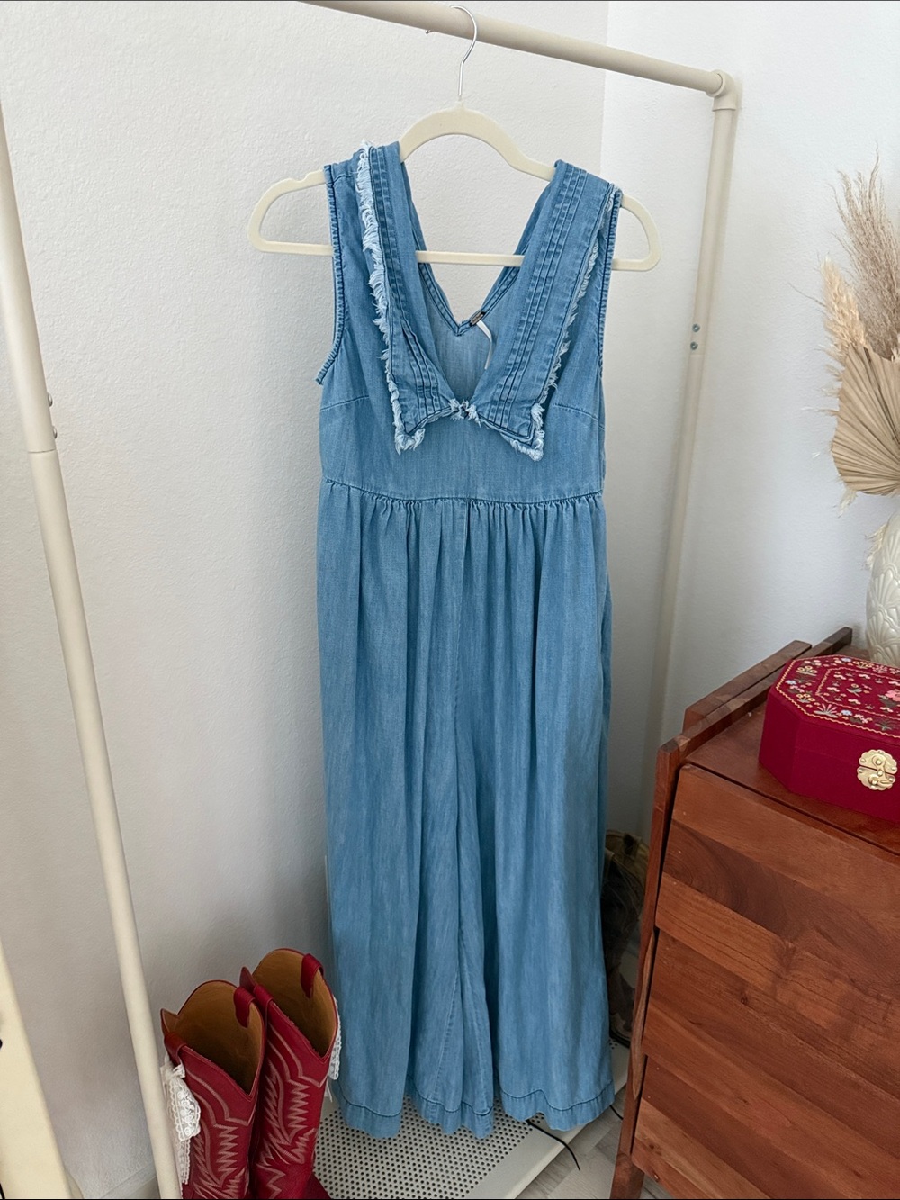 Free People Light Wash Denim Jumpsuit with Frayed V-Neck